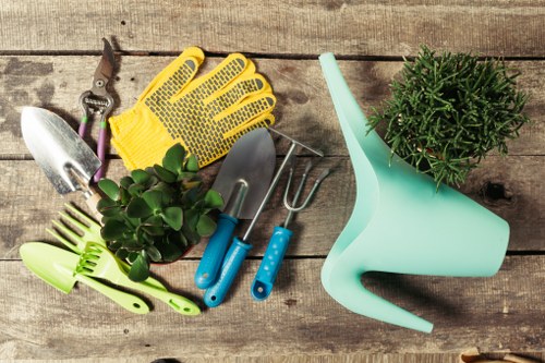 Hainault garden landscaping with patio, planting, and lawn design